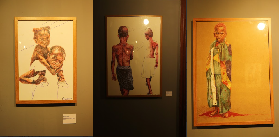 Obras em caneta esferográfica retratando crianças negras na exposição ERÊ de Elson Júnior no MAC Bahia